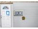 The exterior features a door and utility meters set within a white-painted wall at 340 Bay Plaza, Treasure Island, FL 33706