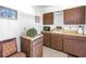 Galley kitchen featuring wood cabinets and a view of a cozy decorative display at 340 Bay Plaza, Treasure Island, FL 33706