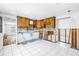 Open kitchen area featuring tile floors and wood cabinets, ready for renovation at 340 Bay Plaza, Treasure Island, FL 33706
