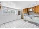 Bright, tile kitchen with a view and wood cabinets, ready for a new design at 340 Bay Plaza, Treasure Island, FL 33706