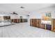 Spacious living area with white tile flooring and ceiling fans at 340 Bay Plaza, Treasure Island, FL 33706