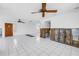 Large living space features tile flooring, ceiling fans, and access to a front entrance at 340 Bay Plaza, Treasure Island, FL 33706