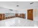 Living area with tile floors, a front door, and large window with water views at 340 Bay Plaza, Treasure Island, FL 33706