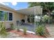 Cozy back porch featuring a grill and outdoor seating, perfect for relaxing and grilling at 3707 Cambridge St, New Port Richey, FL 34652