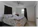 Bedroom with neutral walls, tile flooring, ceiling fan, and a window at 3707 Cambridge St, New Port Richey, FL 34652