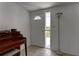 Inviting entryway featuring a decorative door and tiled flooring, leading to the rest of the home at 3707 Cambridge St, New Port Richey, FL 34652