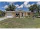 Charming single-story home with a manicured front yard, inviting porch, and attached one-car garage at 3707 Cambridge St, New Port Richey, FL 34652