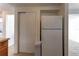 Kitchen view featuring a full-size refrigerator, closet, and tile flooring at 3707 Cambridge St, New Port Richey, FL 34652