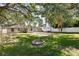 Flat backyard featuring mature trees, a fire pit, and large backyard at 3907 W Azeele St, Tampa, FL 33609
