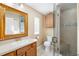 Bathroom with shower featuring glass door, tile, and vanity at 3907 W Azeele St, Tampa, FL 33609