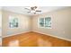 Comfortable bedroom with hardwood floors, dual windows, and ample natural light at 3907 W Azeele St, Tampa, FL 33609