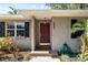 Close-up of the home's front door, surrounded by lush landscaping and a well-maintained exterior at 3907 W Azeele St, Tampa, FL 33609
