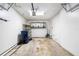 A spacious garage with shelves, overhead storage, and a large door at 3907 W Azeele St, Tampa, FL 33609