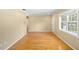 Bright living room featuring gleaming hardwood floors, neutral wall colors, and natural light at 3907 W Azeele St, Tampa, FL 33609