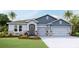 Charming single-Gathering home with a two-car garage and stone accents at 4017 Harvest Hearth Pl, Plant City, FL 33565