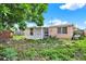 Backyard with screen porch and minimal landscaping at 4025 Chesswood Dr, Holiday, FL 34691