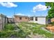 Exterior view of the backyard with partial fencing and some foliage at 4025 Chesswood Dr, Holiday, FL 34691