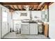 Laundry room featuring utility sink, washer, dryer and water heater at 4025 Chesswood Dr, Holiday, FL 34691
