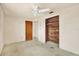Clean bedroom with bright, natural light from a large window and a wood-paneled closet at 4025 Chesswood Dr, Holiday, FL 34691