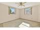 Bedroom featuring natural light from two windows and carpet at 4025 Chesswood Dr, Holiday, FL 34691