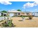Charming single-story home with tidy gravel landscaping, small decorative plants and cheerful curb appeal at 4025 Chesswood Dr, Holiday, FL 34691