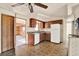 Functional kitchen with wood cabinets, granite countertops, and white appliances at 4025 Chesswood Dr, Holiday, FL 34691