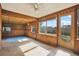 Bright sunroom with paneled walls, and tiled floors at 4025 Chesswood Dr, Holiday, FL 34691