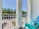 Inviting balcony area featuring outdoor seating and views of the surrounding neighborhood street at 4503 Legacy Park Dr, Tampa, FL 33611