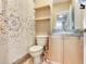 Bathroom featuring open shelving, modern vanity with sink, and decorative shower curtain at 4503 Legacy Park Dr, Tampa, FL 33611