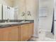 Spacious bathroom with double sinks, granite countertops, and a separate toilet room, offering comfort and privacy at 4503 Legacy Park Dr, Tampa, FL 33611