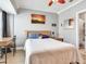 Well-lit bedroom with a work desk and view of the ensuite bathroom at 4503 Legacy Park Dr, Tampa, FL 33611