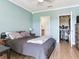 Bedroom featuring a neutral palette, ceiling fan, and a well-organized closet, creating a comfortable ambiance at 4503 Legacy Park Dr, Tampa, FL 33611