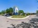 A grand building with a parking lot and a circular landscaped drive to the community entrance at 4503 Legacy Park Dr, Tampa, FL 33611