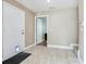 Neutral foyer with tile floor, view into another room, and cat door at 4503 Legacy Park Dr, Tampa, FL 33611