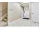 Foyer with neutral tile floor, staircase, and security system at 4503 Legacy Park Dr, Tampa, FL 33611