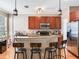 Features of the kitchen include wooden cabinets, stainless appliances, tile backsplash and a breakfast bar at 4503 Legacy Park Dr, Tampa, FL 33611