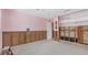 Spacious pink bedroom needing repair, featuring an adjacent closet and good natural light, awaiting renovations at 4720 Coronado S Way, Gulfport, FL 33711
