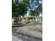 Quaint single-story house with well-maintained lawn, mature trees, and a fenced backyard at 4720 Coronado S Way, Gulfport, FL 33711
