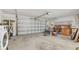 Spacious garage interior offering ample storage and workspace with an open layout and garage door at 4720 Coronado S Way, Gulfport, FL 33711