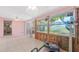 Spacious sun room needing renovation, featuring an adjacent pink room and good natural light, awaiting renovations at 4720 Coronado S Way, Gulfport, FL 33711