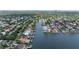 Aerial shot looking down a canal with homes on either side, location marked with a red pin at 4901 W Estrella St, Tampa, FL 33629