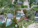 Home with red outline highlighting property lines with surrounding landscaping and nearby neighborhood at 4901 W Estrella St, Tampa, FL 33629