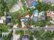 Aerial view of home with red outline showing property lines, surrounding trees, and neighborhood at 4901 W Estrella St, Tampa, FL 33629