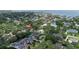 Aerial view of property within a neighborhood with lush trees and waterway access denoted by red pin at 4901 W Estrella St, Tampa, FL 33629