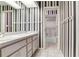 Cozy bathroom with striped wallpaper, a shower, and a double vanity at 4901 W Estrella St, Tampa, FL 33629