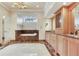 Luxurious bathroom featuring marble accents, a soaking tub, and a double vanity with granite countertops at 4901 W Estrella St, Tampa, FL 33629