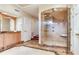 Bright bathroom featuring marble accents, a shower, and a double vanity at 4901 W Estrella St, Tampa, FL 33629