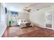 Bedroom featuring hardwood floors, neutral walls, and natural light from a window at 4901 W Estrella St, Tampa, FL 33629