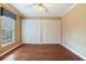 Cozy bedroom showcasing wood flooring and double closets for ample storage space at 4901 W Estrella St, Tampa, FL 33629