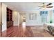 Spacious bedroom with hardwood floors, built-in shelves, and a view into the bathroom at 4901 W Estrella St, Tampa, FL 33629